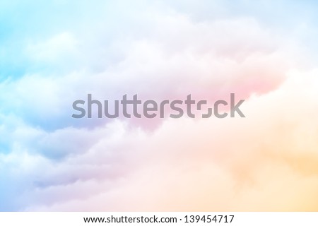 A soft cloud background with a pastel colored orange to blue gradient. Royalty-Free Stock Photo #139454717
