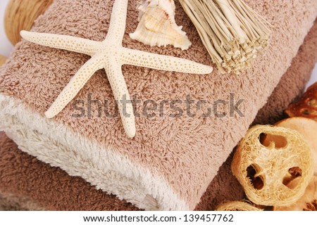 Towels with starfish, shell horizontal closeup picture.