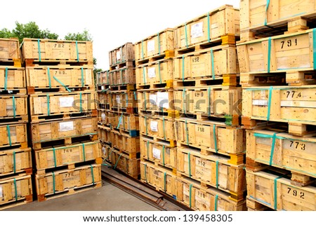 Wooden pallets arrangement on the rack in warehouse