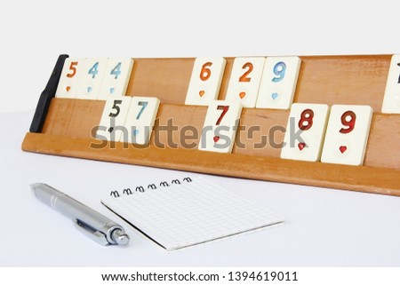 traditional Turkish game okey, plastic chips with numbers on wooden stand