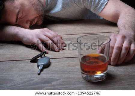 Drinking and driving concept.Drink and car key. Royalty-Free Stock Photo #1394622746