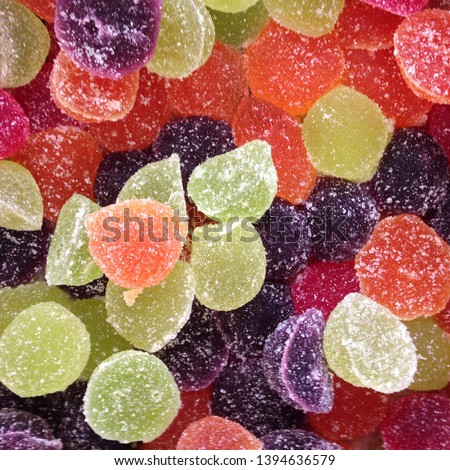 Macro photo artist of multi-colored marmalade jelly candy's. Dessert marmalade in the form of lemon and orange slices. The sweetness of jelly candy yellow and orange.