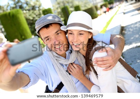 Couple taking picture of themselves with smartphone
