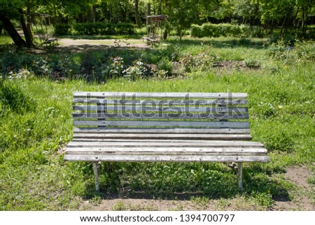 Old bench in the park at summer. Vintage retro bench
