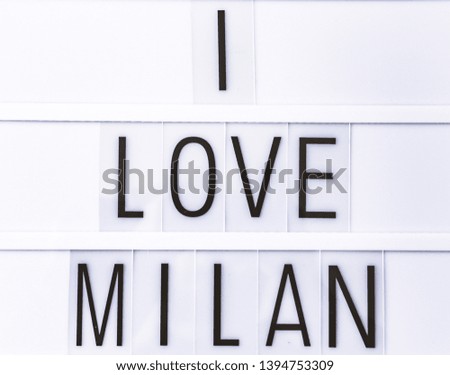 Text "I LOVE MILAN"  written on white slate