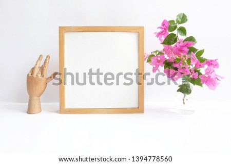 blank square frame styled with flowers
