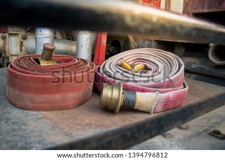 two fire hose with orange light 
