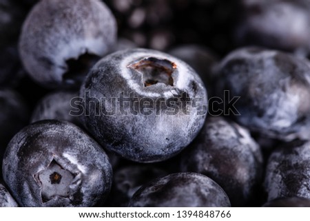 Blueberries and blackberries berries close-up.