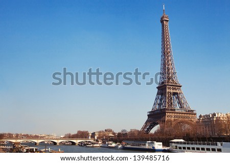 Eiffel Tower and bridge over Seine river in Paris, France