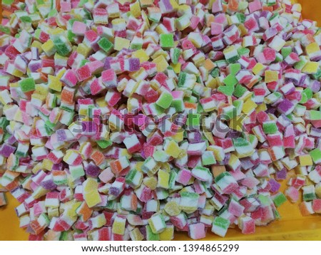 Pictures of multi-colored candy and taste are sold in the night market in malaysia.