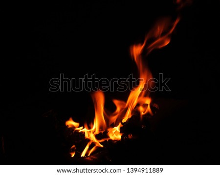 The yellow-red fire that burns to the wind On a black background