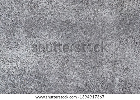 Detailed surface of aged and weathered concrete and cement walls with cracks in high resolution