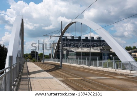 Steel arched modern tram bridge