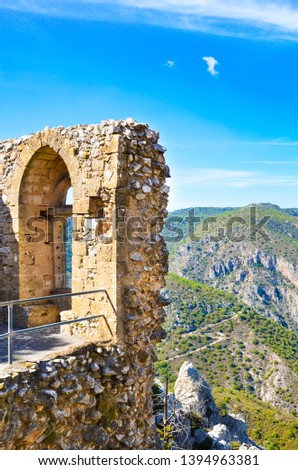 Vertical photo capturing ruins of Saint Hilarion Castle in Northern Cyprus. The popular view points offers an amazing view of beautiful Kyrenia region and Mediterranean. Cypriot tourist attraction.