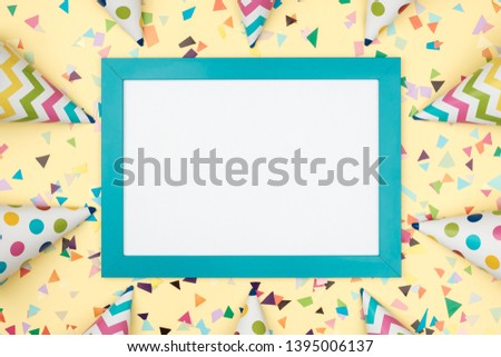 Blank card with colorful party items on a colorful background