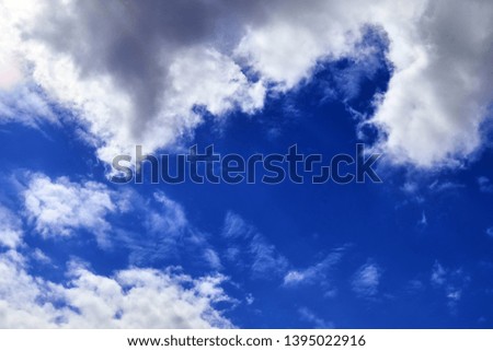 Beautiful white cloud formations in a deep blue sky on a sunny day