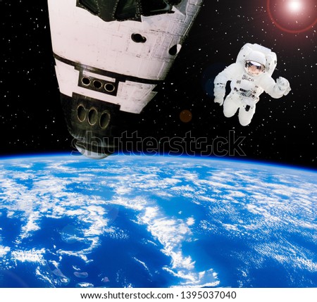 Astronaut above earth and spaceship. The elements of this image furnished by NASA.
