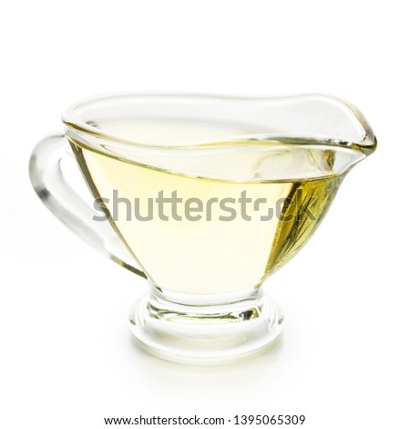 Olive oil in glass jar isolated on white background