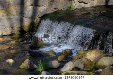 small waterfall on the river in the forest