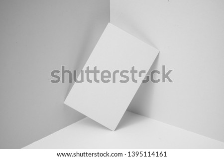 Design concept - perspective view of vertical black business card on white 3D space background for mockup, it's real photo, not 3D render