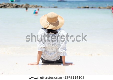 Young women traveling relax on the beach on summer, Concept beach on summer