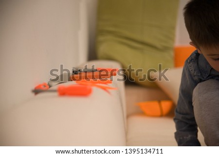 Sweet little boy playing with tool