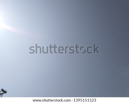 the sun in the sky is photographed directly in the summer