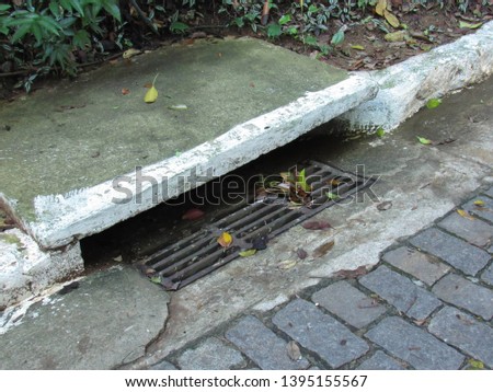 Water drain in a paving stone street
