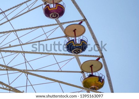 Ferris wheel on background of blue sky