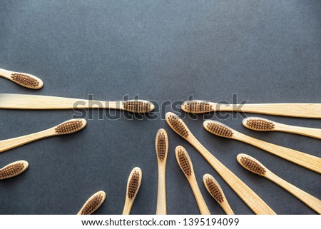 bamboo toothbrushes on dark rough background. plastic-free concept