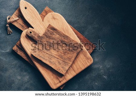 Vintage wooden cutting boards on a gray background, flat lay. Overhead view, copy space