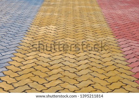 A block of yellow blue red cement ground floor, texture background
