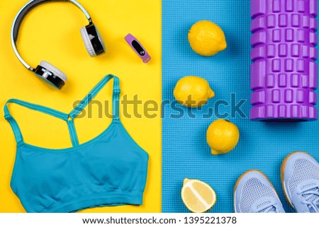 Fitness equipment. Woman workout accessories and clothes flat lay. Top view, fitness background