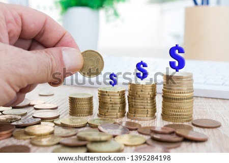 coins stacked with dollar symbol, savings