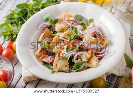 Delicious salad with fresh vegetable, crispy croutons and cheese