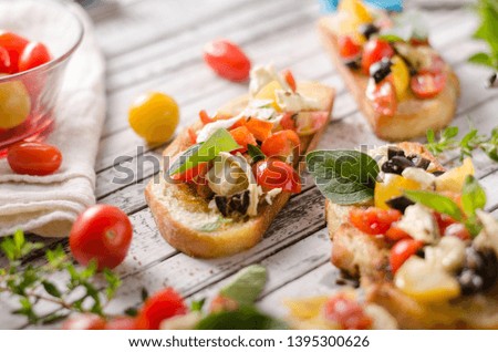 Delish simple food, roasted homemade bread with garlic and herbs, fresh vegetable and cheese
