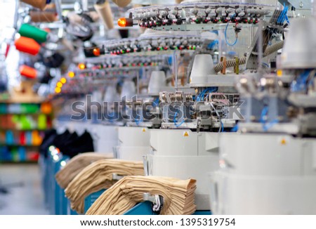 hosiery factory sock machine thread
string strand
 Royalty-Free Stock Photo #1395319754