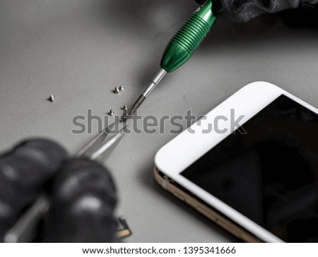 smartphone repair on a work desk