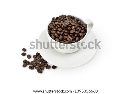 Roasted coffee beans in white cup isolated on white background view. Clipping path. 