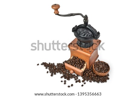 Vintage Coffee grinder wooden with Roasted coffee beans isolated on white background view with Clipping path.