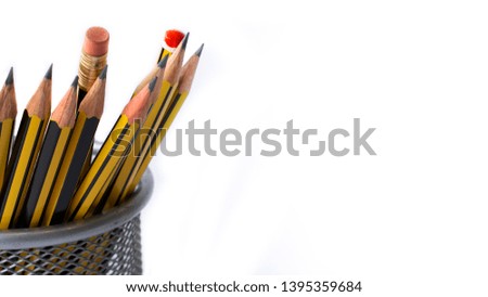 Closeup of many wooden pencils  in a pencil case isolated on an infinite white background.-image