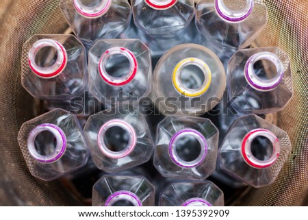 closeup multicolored plastic bottles in trash can. recycling To conserve the environment concept