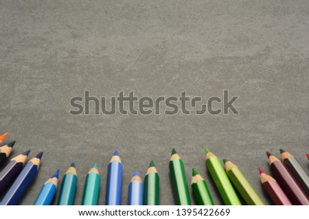 Group of colored pencils on desk with copy space