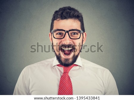 portrait of super excited surprised businessman