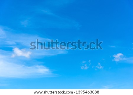 blue sky with white, soft clouds in the springtime