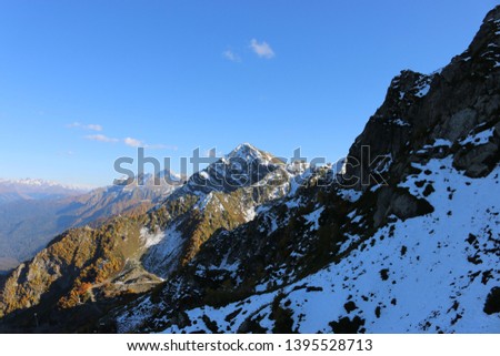Caucasus mountains from a height of more than 2300 meters above sea level on a clear day, in the photo ridges, trees,  forest, meadows, snow
