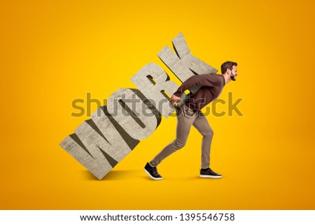 Young man in casual clothes carrying heavy WORK sign on his back on yellow background. Digital art. Job and career. Working hard.