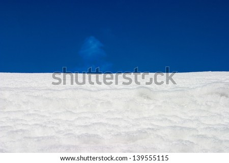 Snow field with blue sky