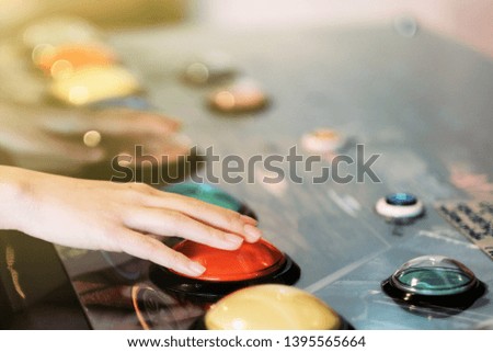 A gamer kid playing Arcade game machine 