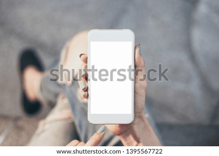 Mockup image woman hand holding texting using black mobile,cell phone with copy space,white blank screen for text.concept for contact business,people communication,technology electronic device